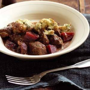 Cooked braising steak pieces with vegetables