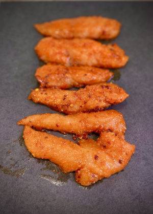Marinated Chicken Strips Marinated Chicken Strips on a grey surface