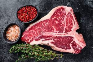 porterhouse steak being prepared