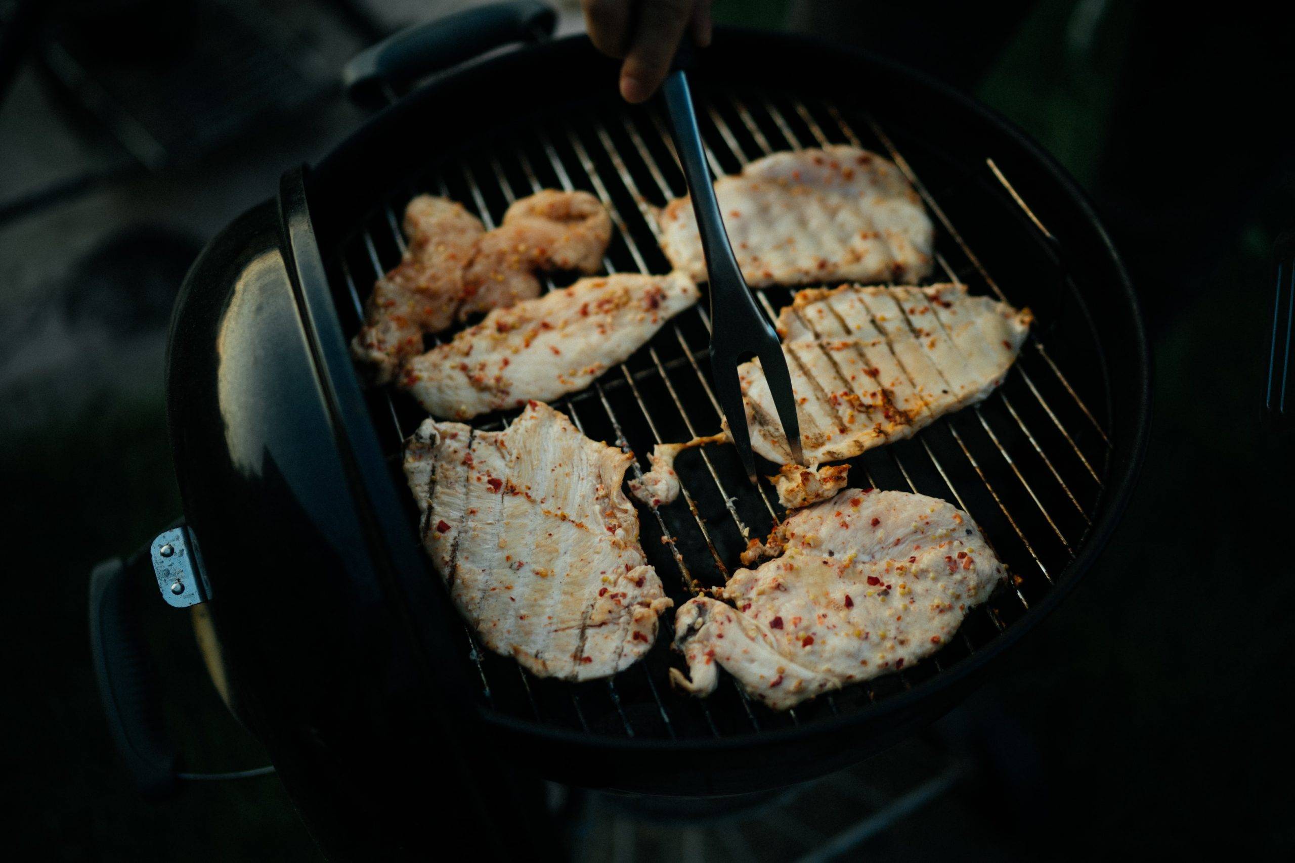 Chicken being cooked on a BBQ