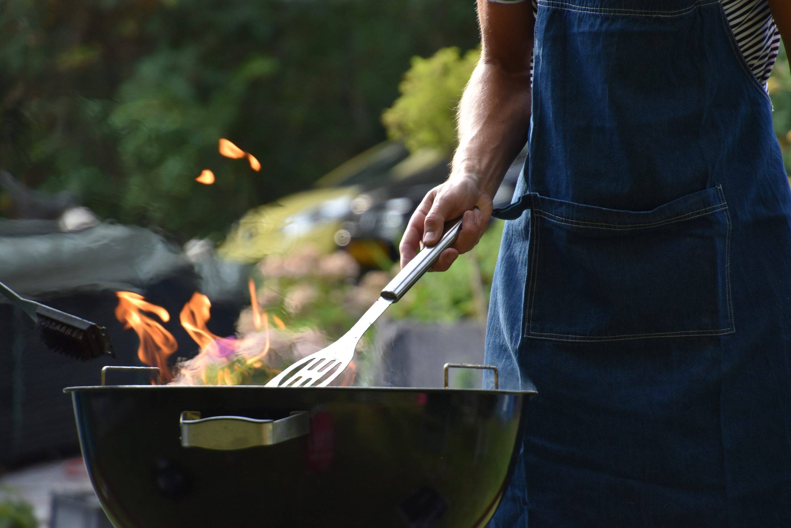 Man barbequing outside